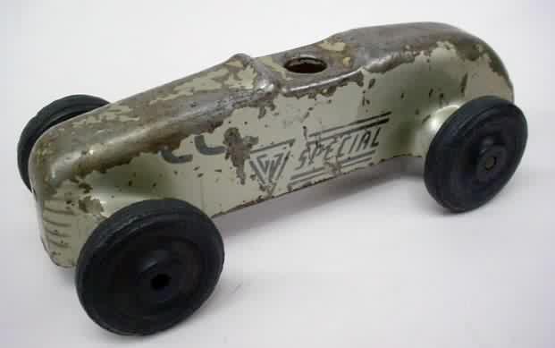  wheel race car pressed steel with large black rubber tires 1950's